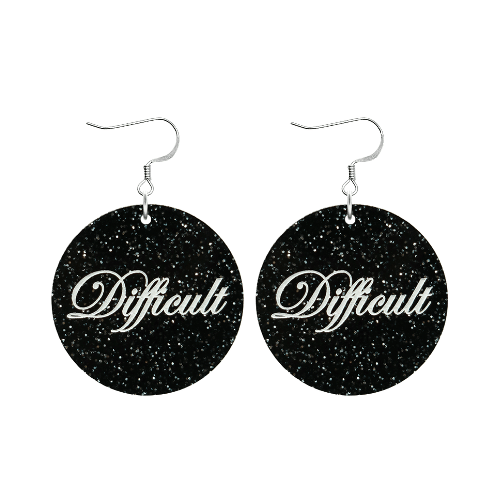 haus of dizzy black glittery circle earrings with cursive text that reads difficult in white, with silver hooks no circle tops