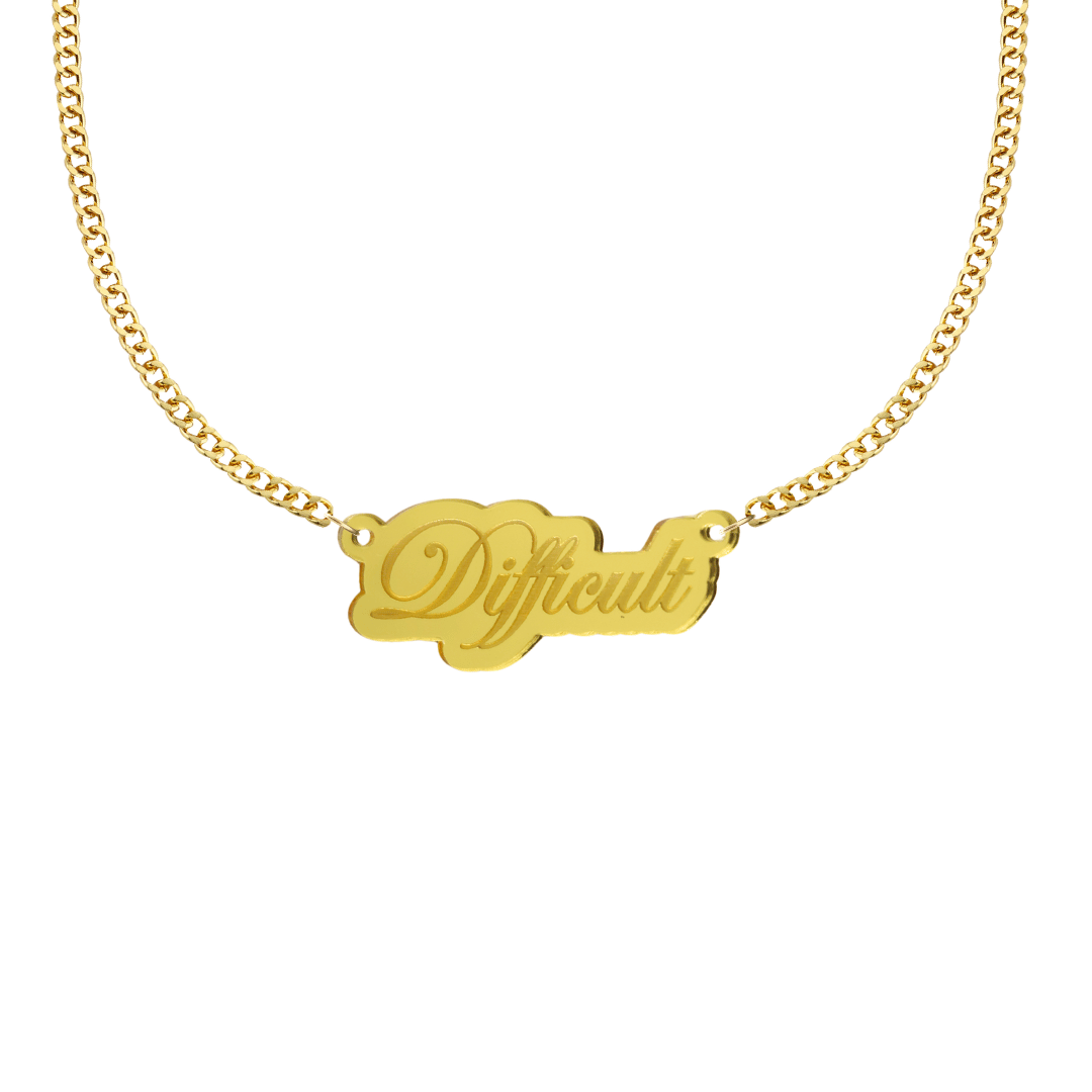 haus of dizzy gold mirror acrylic necklace with a pendant that reads 'Difficult' with gold chain