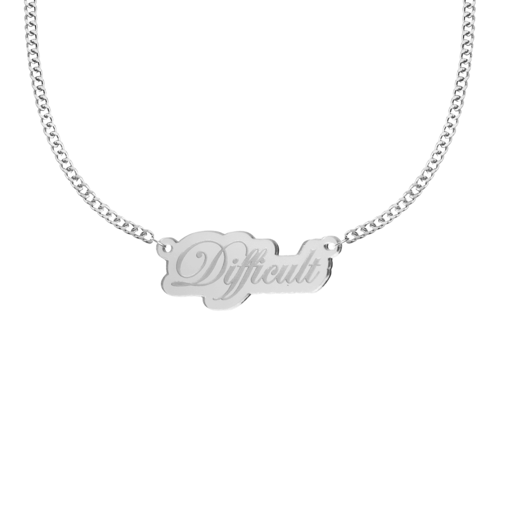 haus of dizzy silver mirror acrylic necklace with a pendant that reads 'Difficult' with silver chain