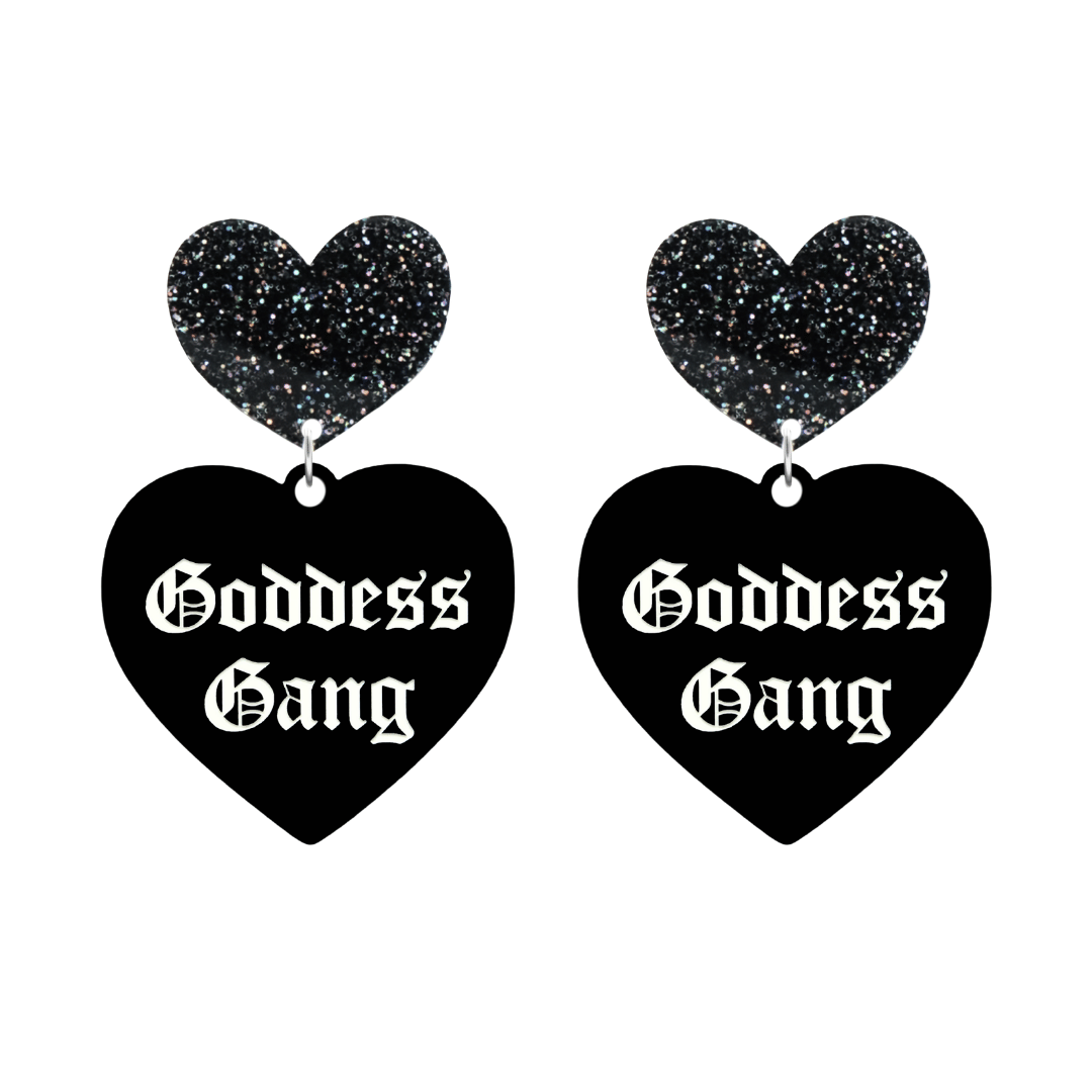 haus of dizzy black Heart-shaped earrings with 'Goddess Gang' text in white old english font with black glittery hearts tops size large