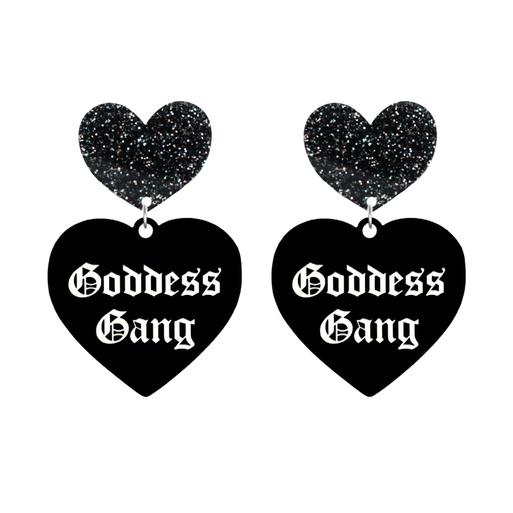 haus of dizzy black Heart-shaped earrings with 'Goddess Gang' text in white old english font with black glittery hearts tops size large