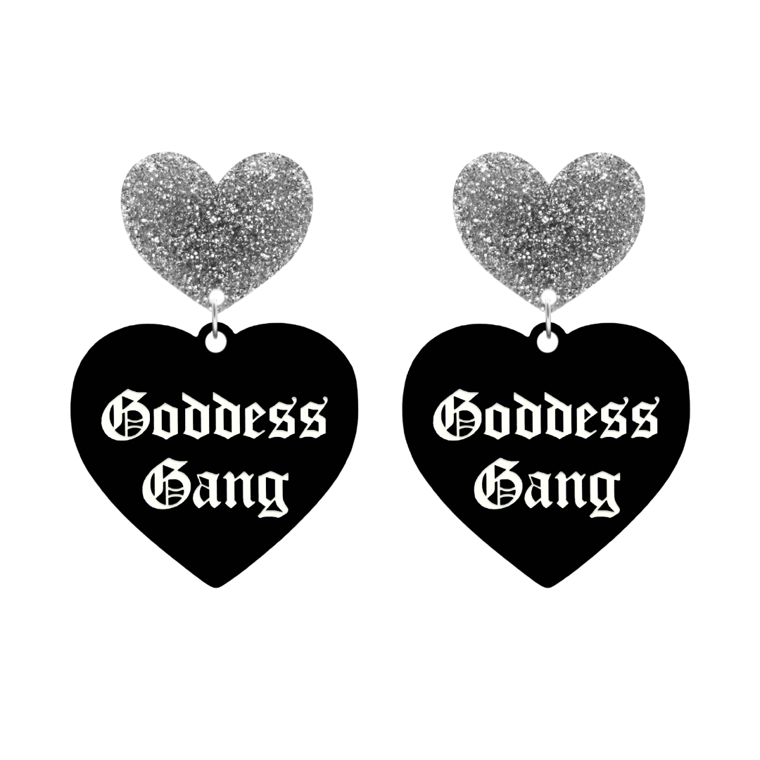haus of dizzy black Heart-shaped earrings with 'Goddess Gang' text in white old english font with silver glittery hearts tops size large