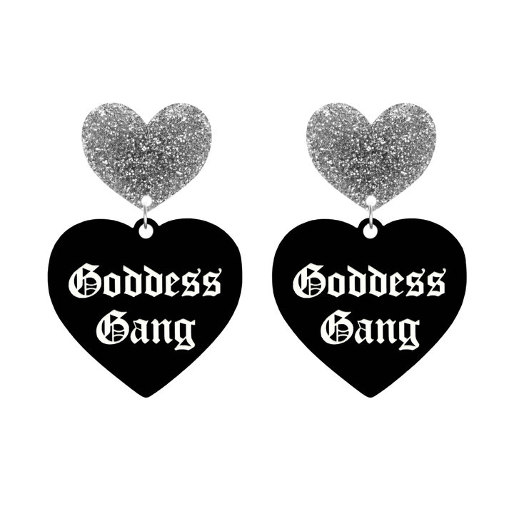 haus of dizzy black Heart-shaped earrings with 'Goddess Gang' text in white old english font with silver glittery hearts tops size large