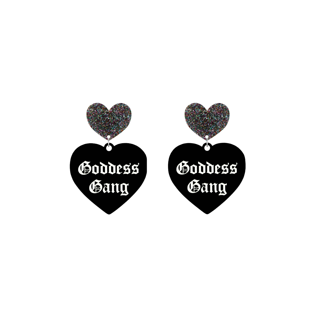 haus of dizzy black Heart-shaped earrings with 'Goddess Gang' text in white old english font with multi coloured glittery hearts tops size small