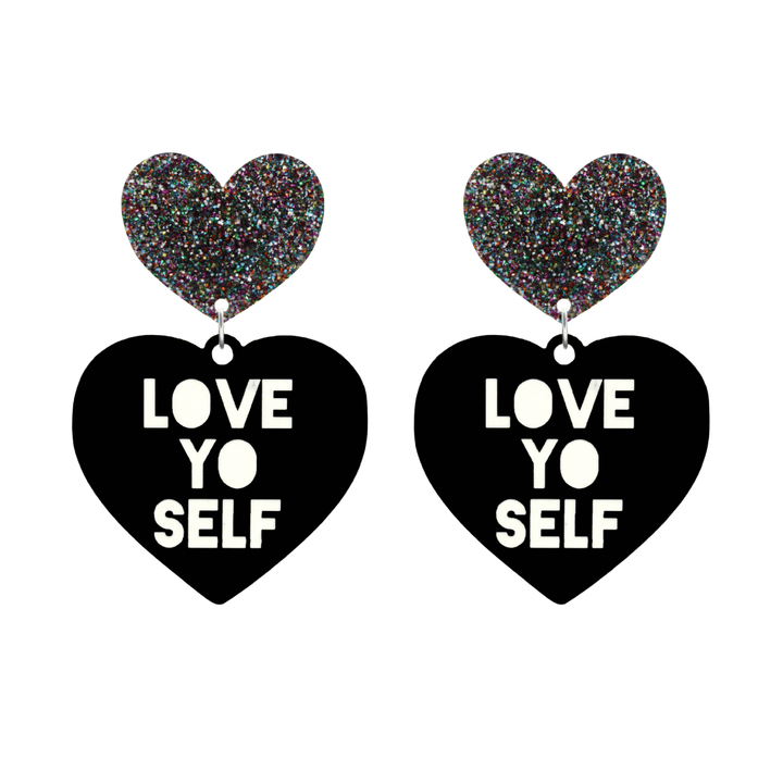 haus of dizzy black Heart-shaped earrings with 'LOVE YO SELF' text in white and multi coloured glittery hearts tops size large