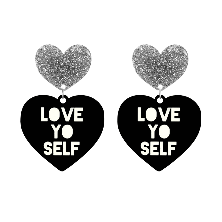 haus of dizzy black Heart-shaped earrings with 'LOVE YO SELF' text in white and silver glittery hearts tops size large
