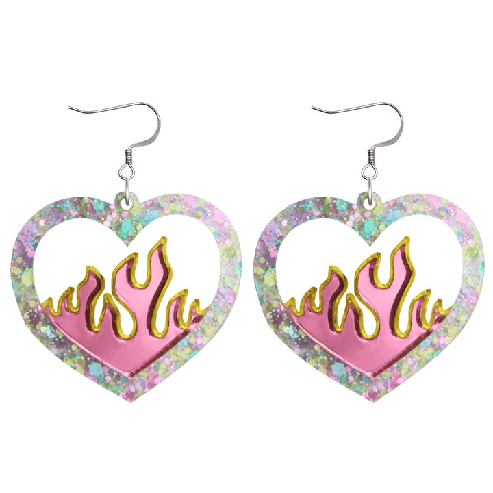 Heart-shaped earrings with flame design and multicolored glittery border on a white background with hooks