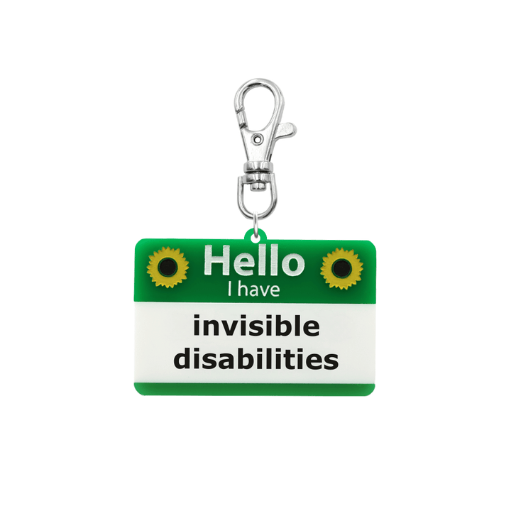 haus of dizzy green and white lanyard tag keychain with painted sunflowers with text that reads hello i have invisible disabilities size small plural