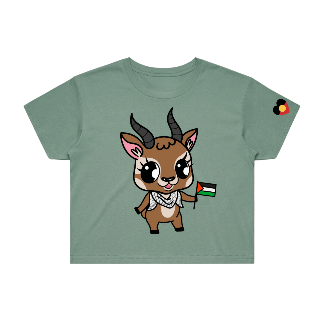 sage green crop t-shirt with cartoon mountain gazelle, Jamal, on front. he is holding a Palestine flag and wearing a Keffiyeh. The t-shirt is on a white background.