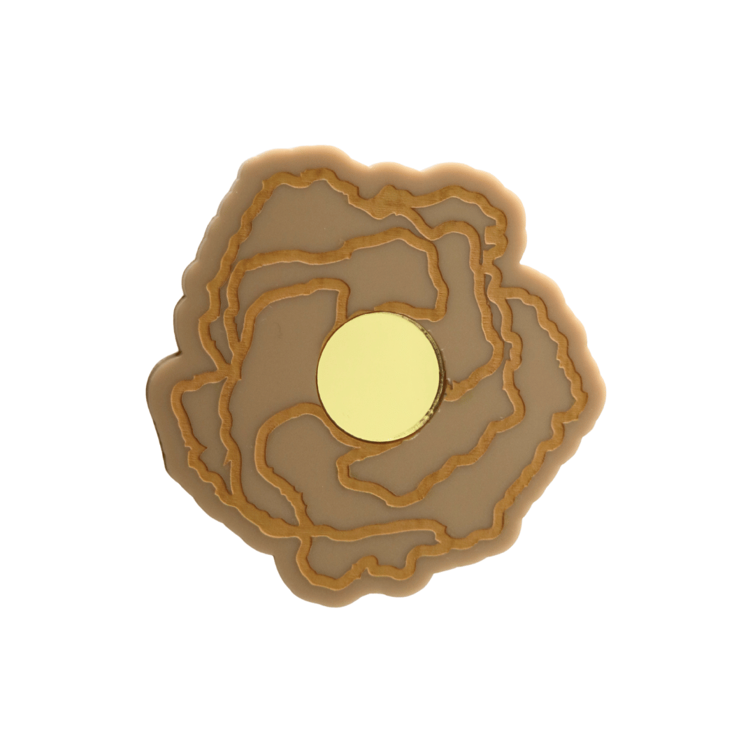 haus of dizzy x kylie monteleone collab badge with aboriginal art that depicts the desert rose. using cappuccino matte acrylic and tan hand painted details on flower with a gold mirror acrylic centre. he desert rose thrives in harsh conditions as do we. badge comes with secure locking pin to ensure all day wear. badge is 5.7cm.