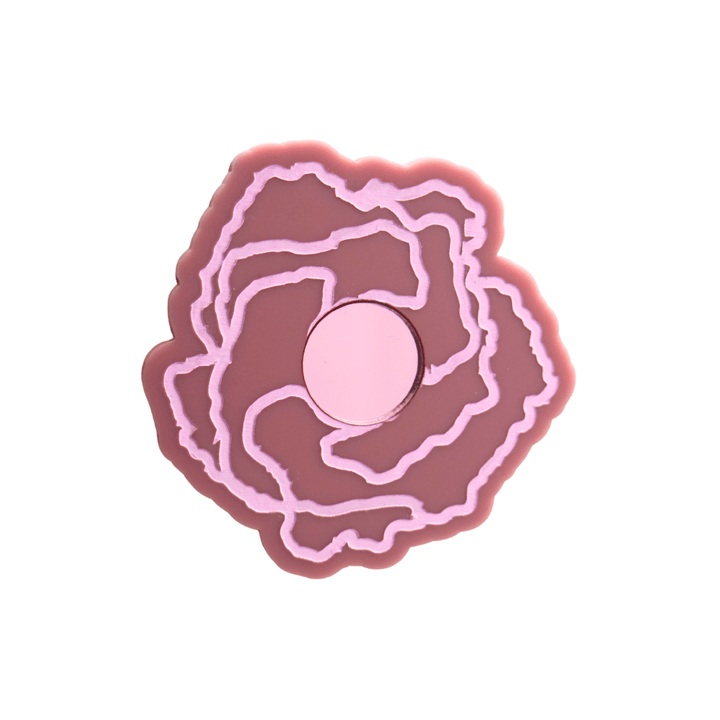 haus of dizzy x kylie monteleone collab badge with aboriginal art that depicts the desert rose. using dusty rose matte acrylic and light pink hand painted details on flower with a pink mirror acrylic centre. he desert rose thrives in harsh conditions as do we. badge comes with secure locking pin to ensure all day wear. badge is 5.7cm.