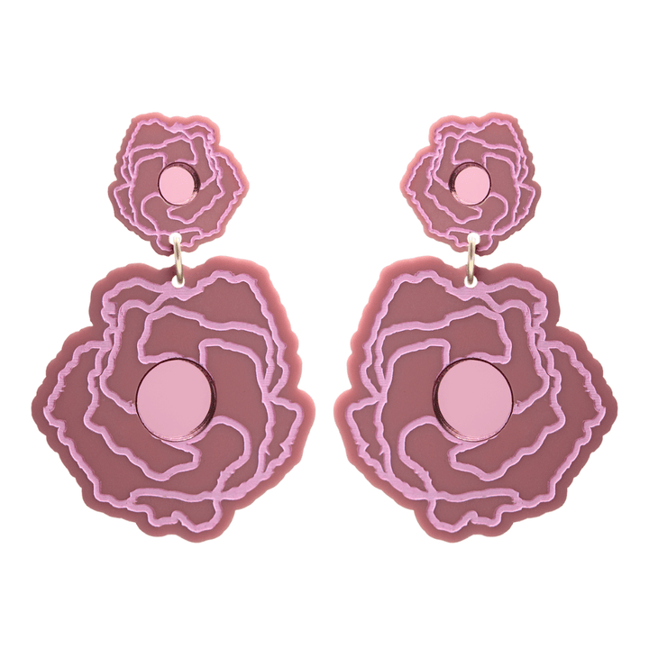 haus of dizzy x kylie monteleone collab earrings with aboriginal art that depicts the desert rose. using dusty rose matte acrylic and light pink hand painted details on flower with a pink mirror acrylic centre. he desert rose thrives in harsh conditions as do we. earrings come as studs only. 