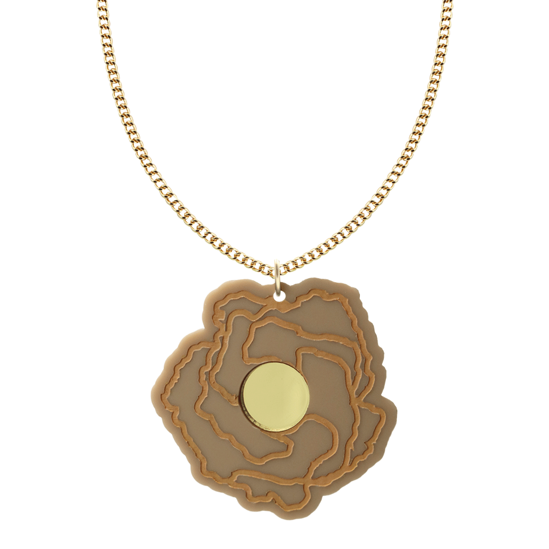 haus of dizzy x kylie monteleone collab necklace with aboriginal art that depicts the desert rose. using cappuccino matte acrylic and light brown hand painted details on flower with a gold mirror acrylic centre. the desert rose thrives in harsh conditions as do we. charm size is 5.7cm on a gold chain.