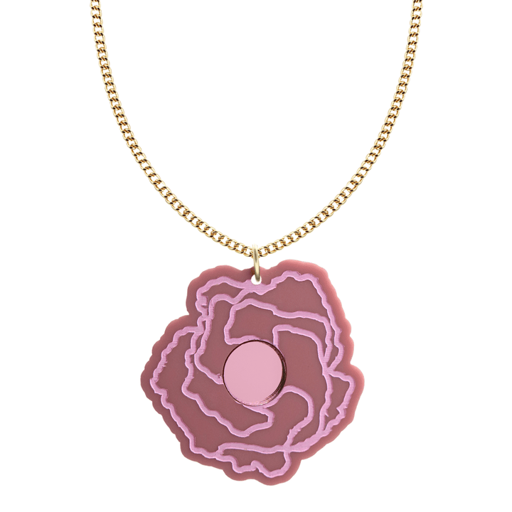 haus of dizzy x kylie monteleone collab necklace with aboriginal art that depicts the desert rose. using dusty rose matte acrylic and light pink hand painted details on flower with a pink mirror acrylic centre. the desert rose thrives in harsh conditions as do we. charm size is 5.7cm on a gold chain.