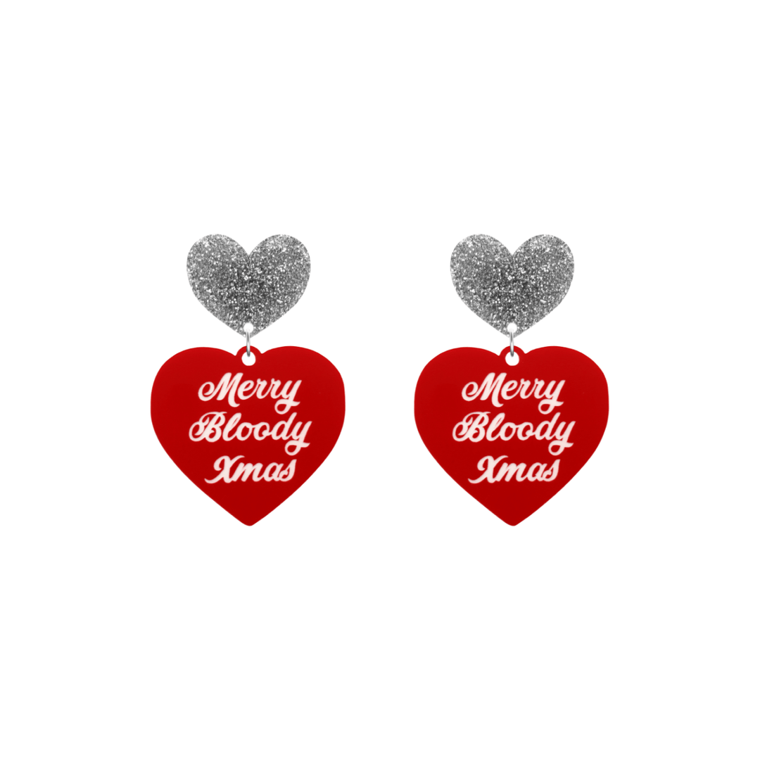 haus of dizzy red heart-shaped earrings with 'Merry Bloody Xmas' white text with silver glitter heart stud tops size small