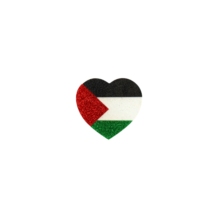 An image of haus of dizzy's heart-shaped pin featuring the flag of Palestine, with black, white, green, and red glitter acrylic size small