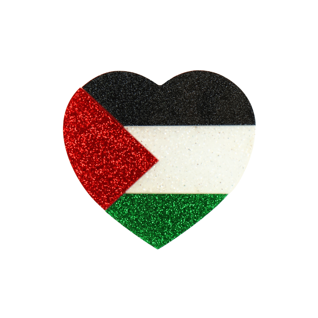 An image of haus of dizzy's heart-shaped pin featuring the flag of Palestine, with black, white, green, and red glitter acrylic size large