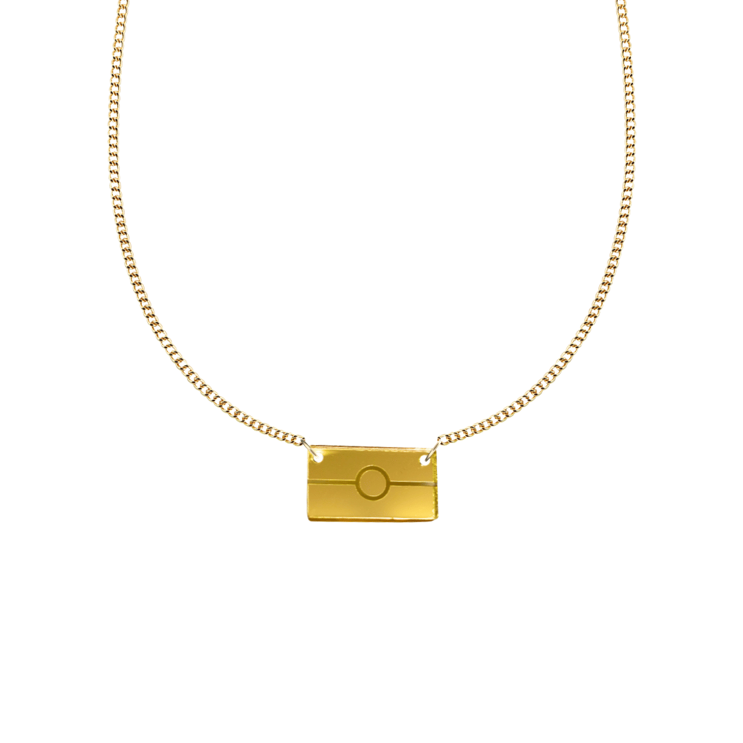 Gold mirror acrylic rectangle pendant necklace with engraved Aboriginal flag. It is on a white background. size extra small
