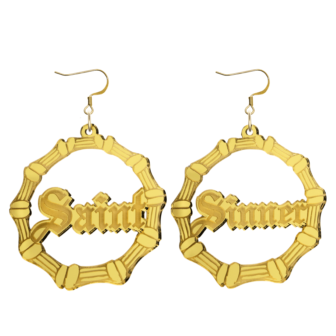 haus of dizzy saint sinner acrylic bamboo hoop earrings in a gothic Old English font, with one hoop reading “Saint” and the other “Sinner,” in a gold mirror acrylic with hooks no circle stud tops size large