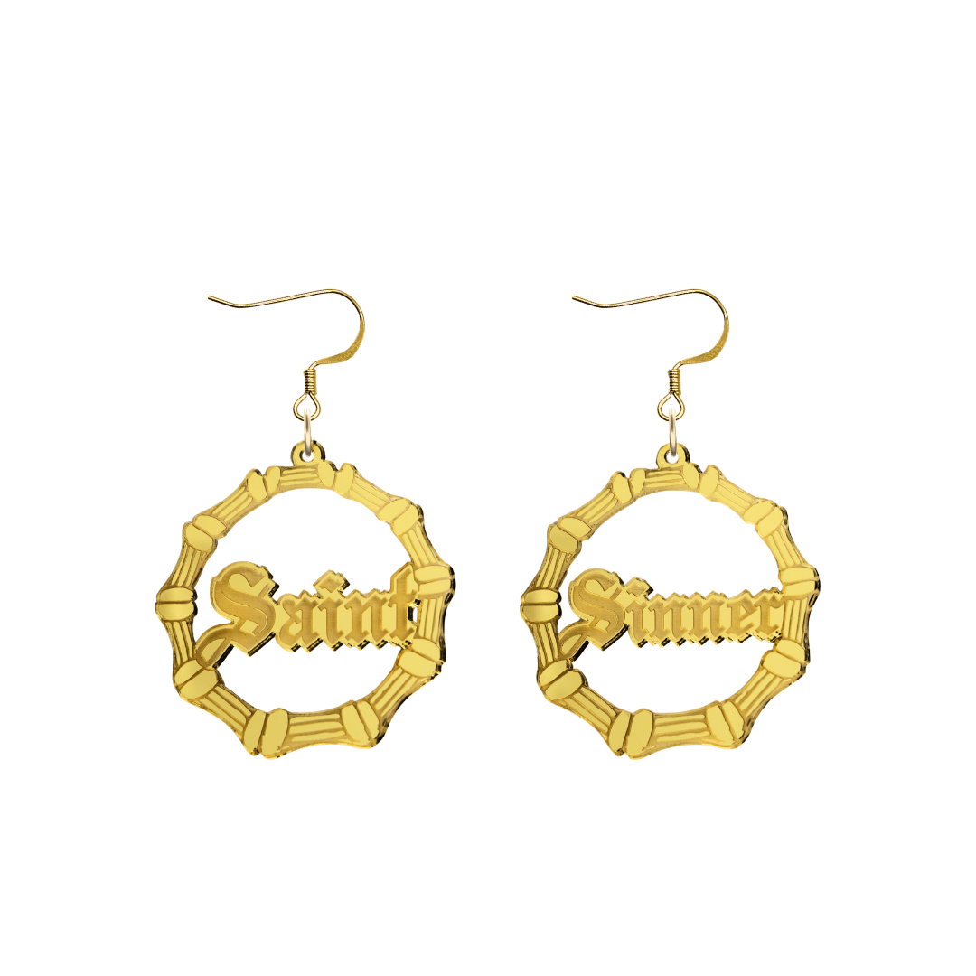 haus of dizzy saint sinner acrylic bamboo hoop earrings in a gothic Old English font, with one hoop reading “Saint” and the other “Sinner,” in a gold mirror acrylic with hooks no circle stud tops size small