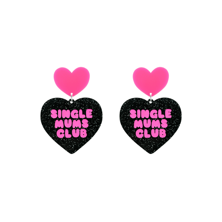 haus of dizzy earrings with a black glittery acrylic heart shape body and a hot pink acrylic top in the shape of a heart, with the phrase 'single mums club' hand painted in hot pink size small