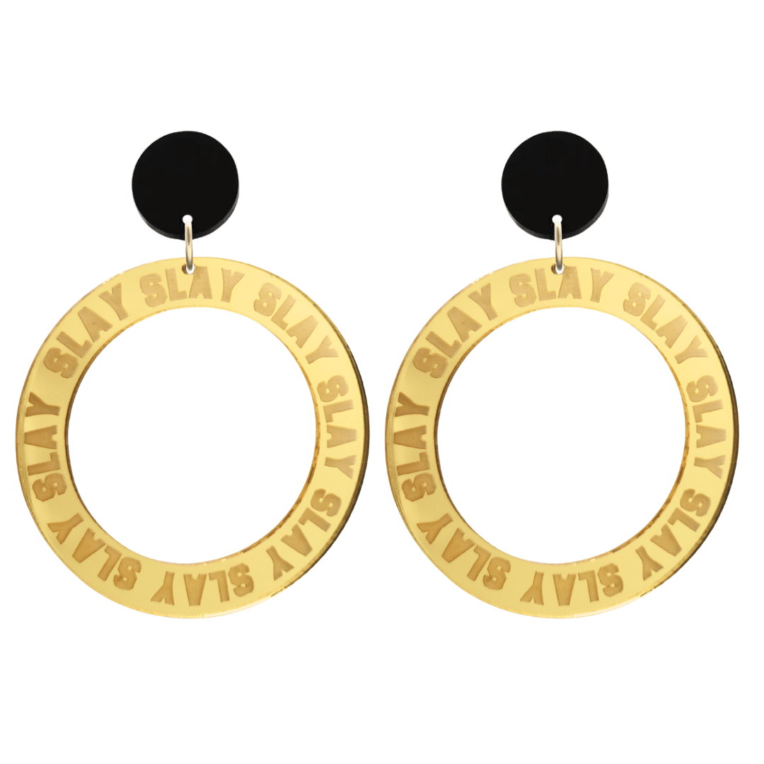 haus of dizzy mirror gold acrylic hoop earrings with repeated 'SLAY' etched text around the hoop size large with black circle tops