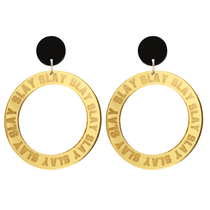haus of dizzy mirror gold acrylic hoop earrings with repeated 'SLAY' etched text around the hoop size large with black circle tops