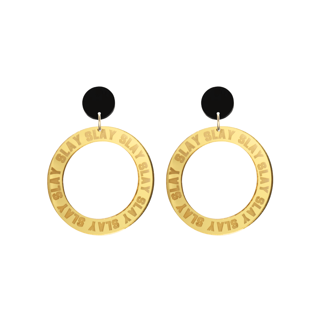 haus of dizzy mirror gold acrylic hoop earrings with repeated 'SLAY' etched text around the hoop size small with black circle tops