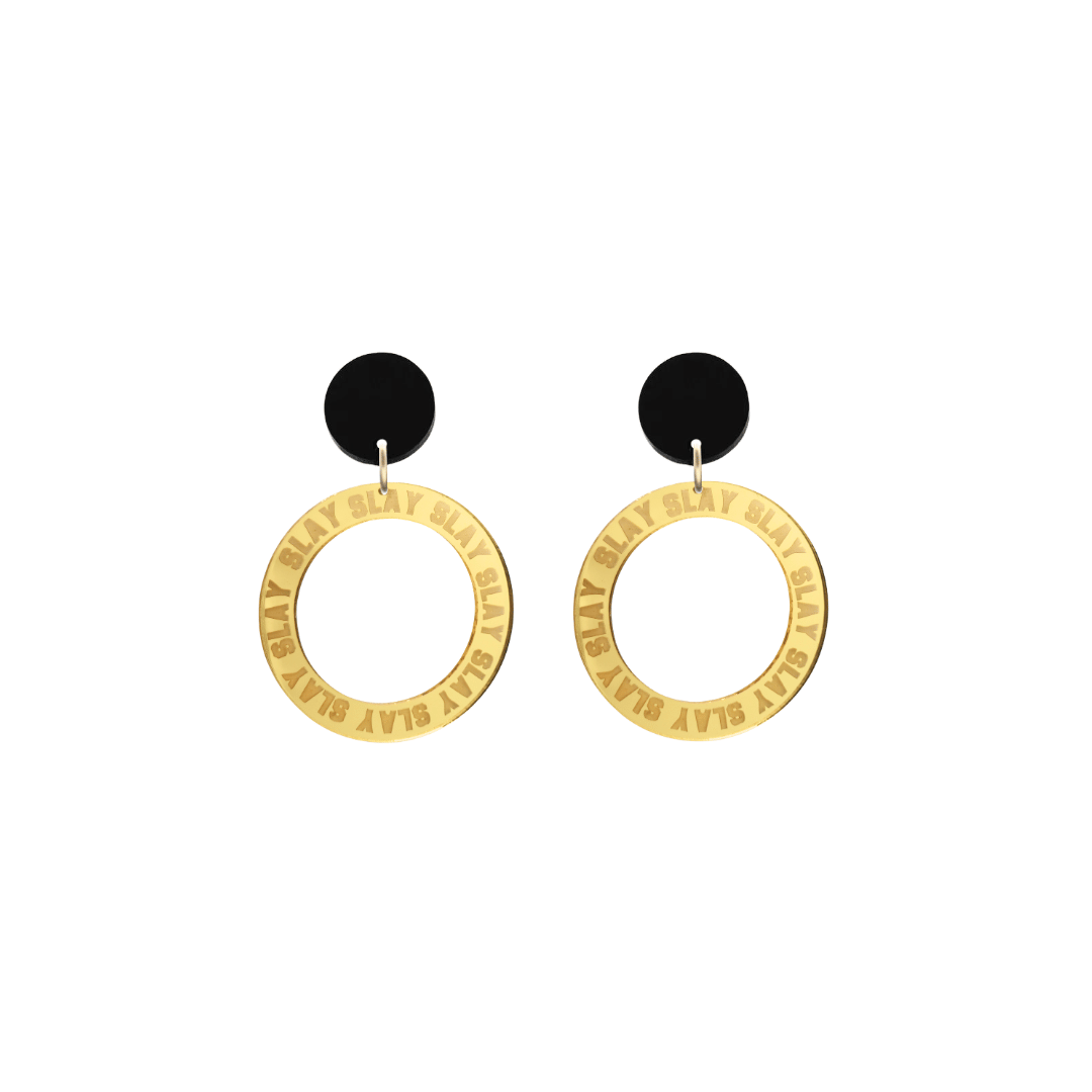haus of dizzy mirror gold acrylic hoop earrings with repeated 'SLAY' etched text around the hoop size extra small with black circle tops