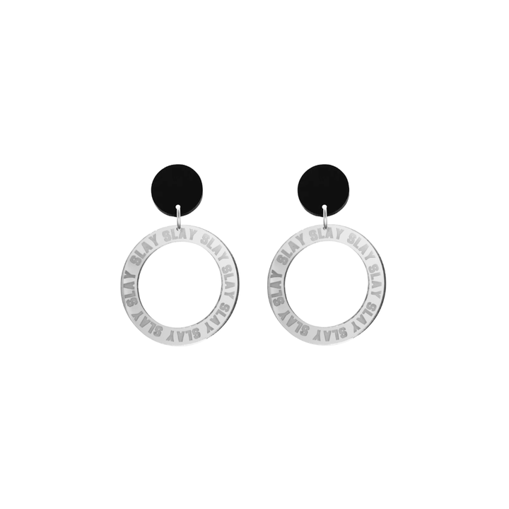 haus of dizzy mirror silver acrylic hoop earrings with repeated 'SLAY' etched text around the hoop size extra small with black circle tops