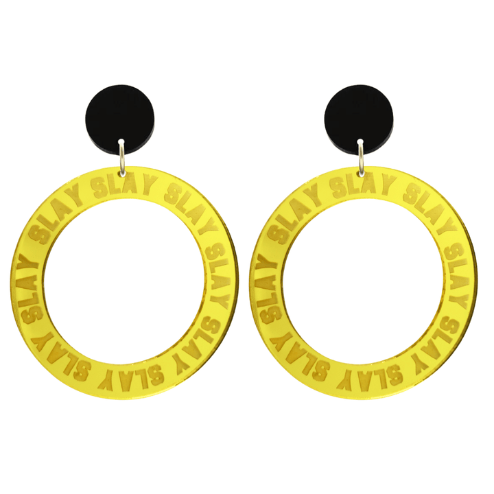 haus of dizzy mirror yellow acrylic hoop earrings with repeated 'SLAY' etched text around the hoop size large with black circle tops