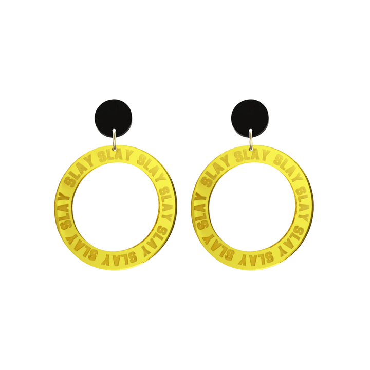 haus of dizzy mirror yellow acrylic hoop earrings with repeated 'SLAY' etched text around the hoop size small with black circle tops