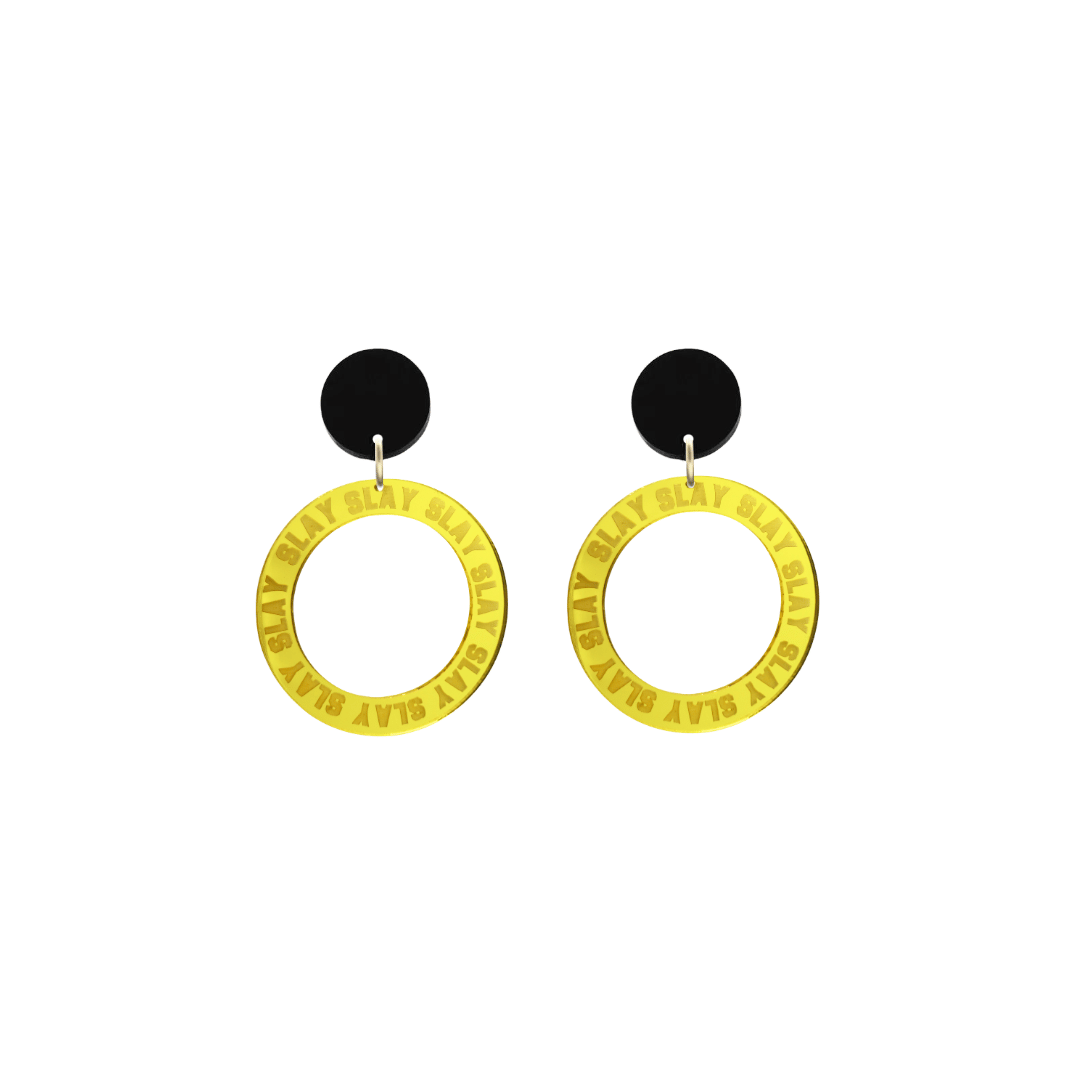 haus of dizzy mirror yellow acrylic hoop earrings with repeated 'SLAY' etched text around the hoop size extra small with black circle tops