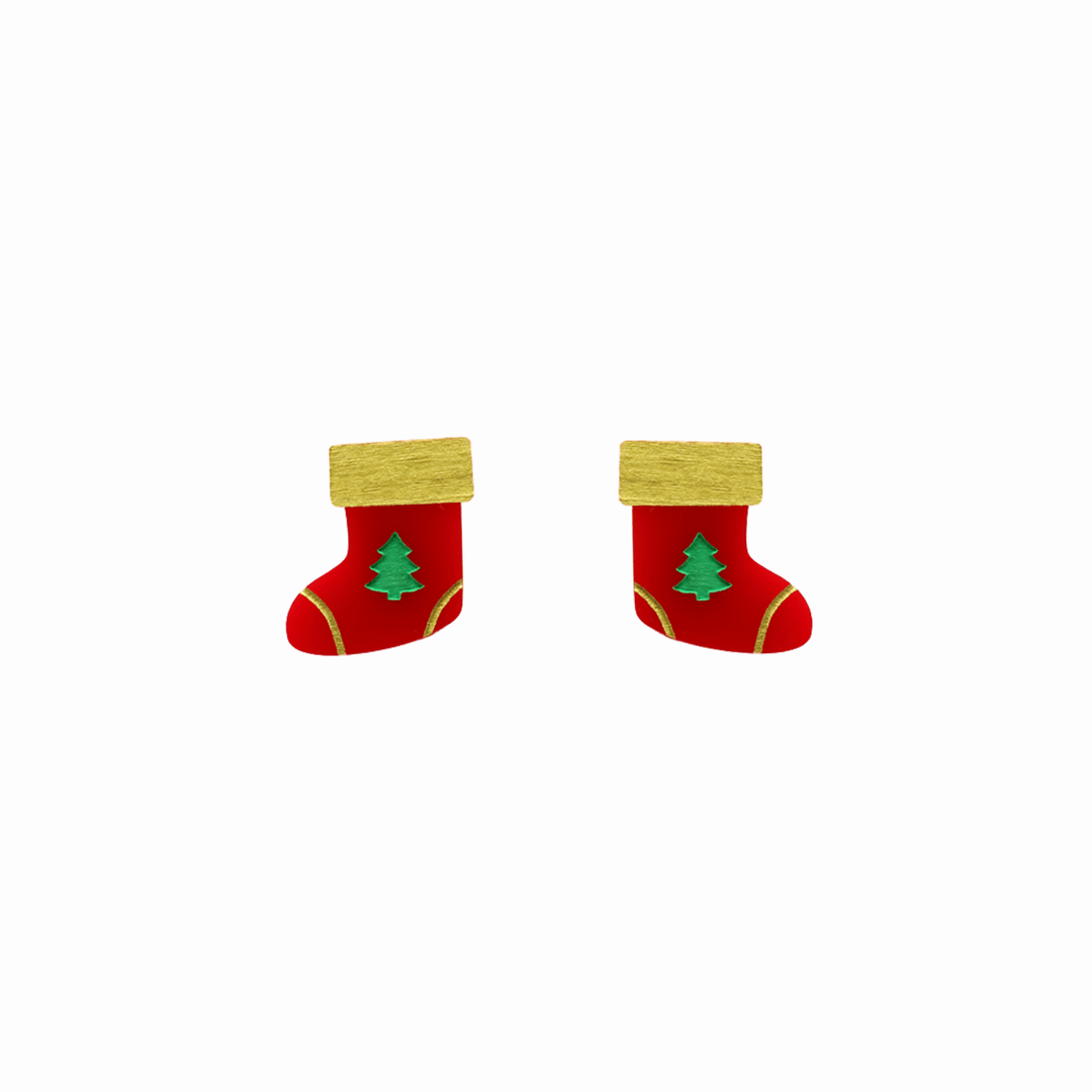 haus of dizzy stocking stuffers studs. red gloss Christmas stockings with green trees and gold detailing one size