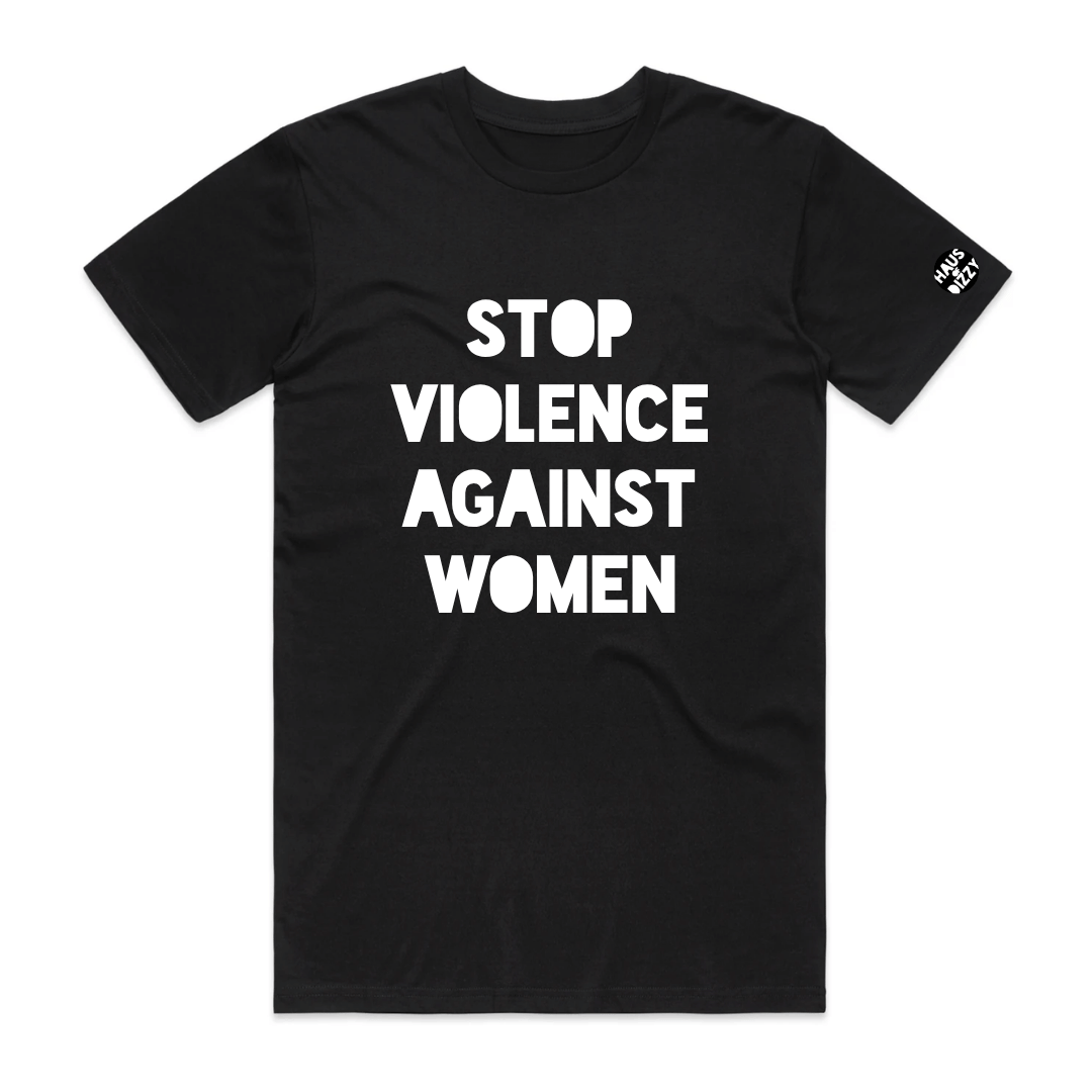haus of dizzys black t-shirt featuring the printed text 'STOP VIOLENCE AGAINST WOMEN' in white bold text. A small circular logo is printed on the left sleeve.