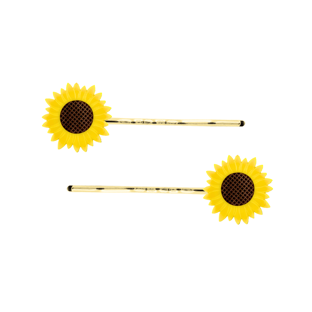 image of two haus of dizzy sunflower charms on gold hair pins. sunflowers are made from yellow and brown matte etched acrylic