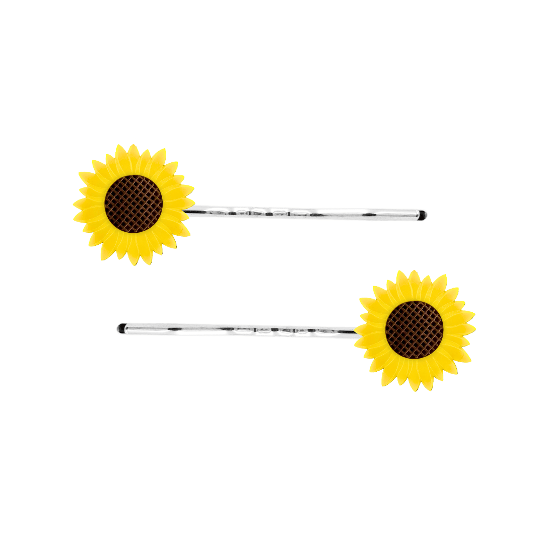image of two haus of dizzy sunflower charms on silver hair pins. sunflowers are made from yellow and brown matte etched acrylic