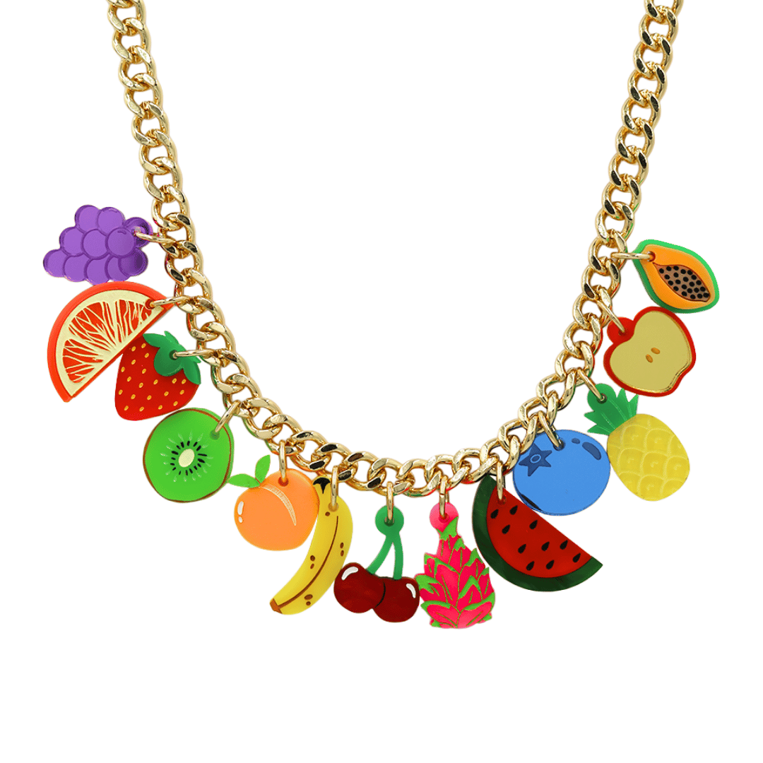 An image of Haus of Dizzy's too fruity 'fruit salad' Charm Necklace, which features various fruit-themed acrylic charms on a gold chain. 
