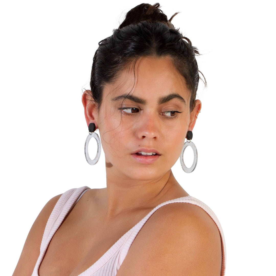 Silver Wiradjuri Women mirror Hoops on model