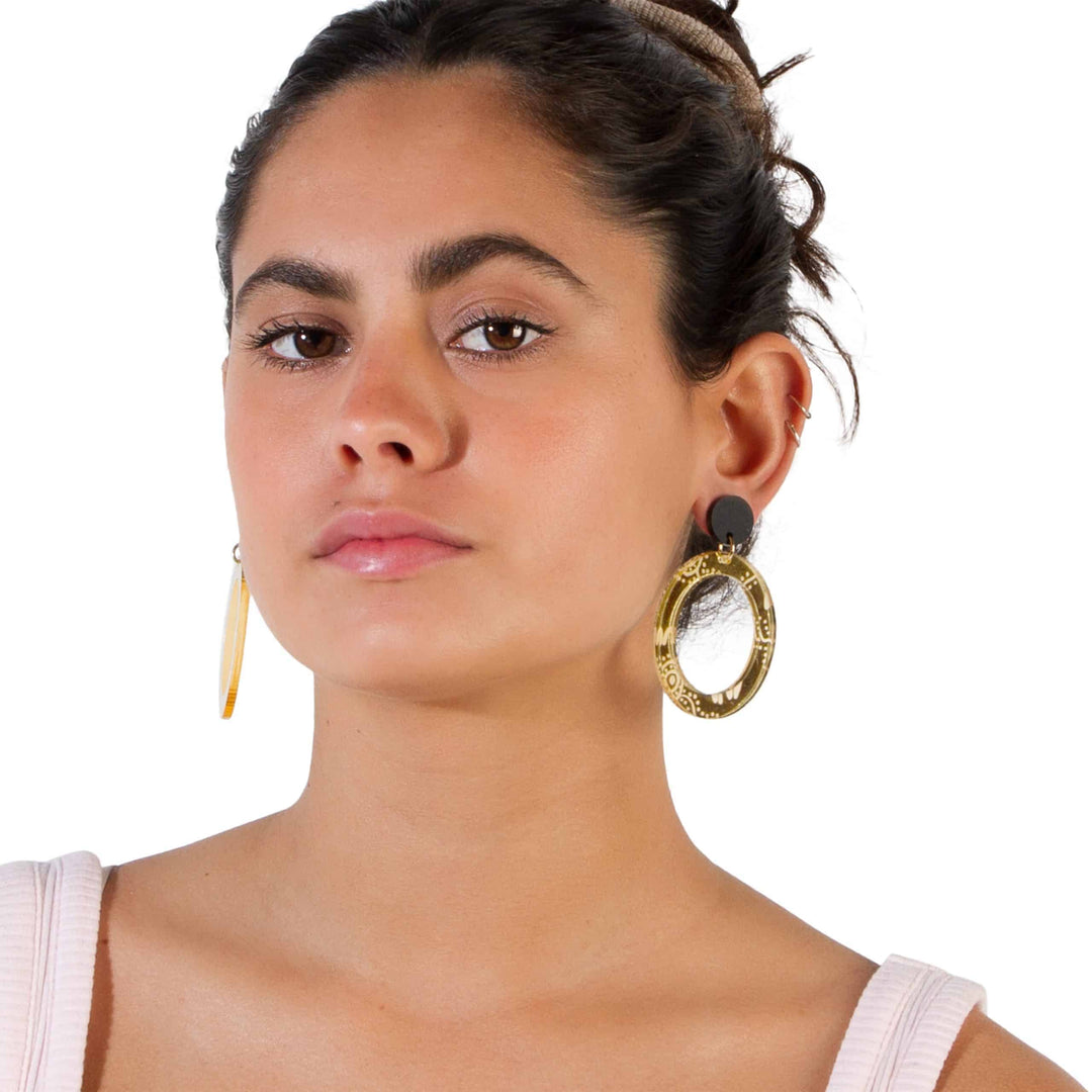 Gold Wiradjuri Women mirror Hoops on model